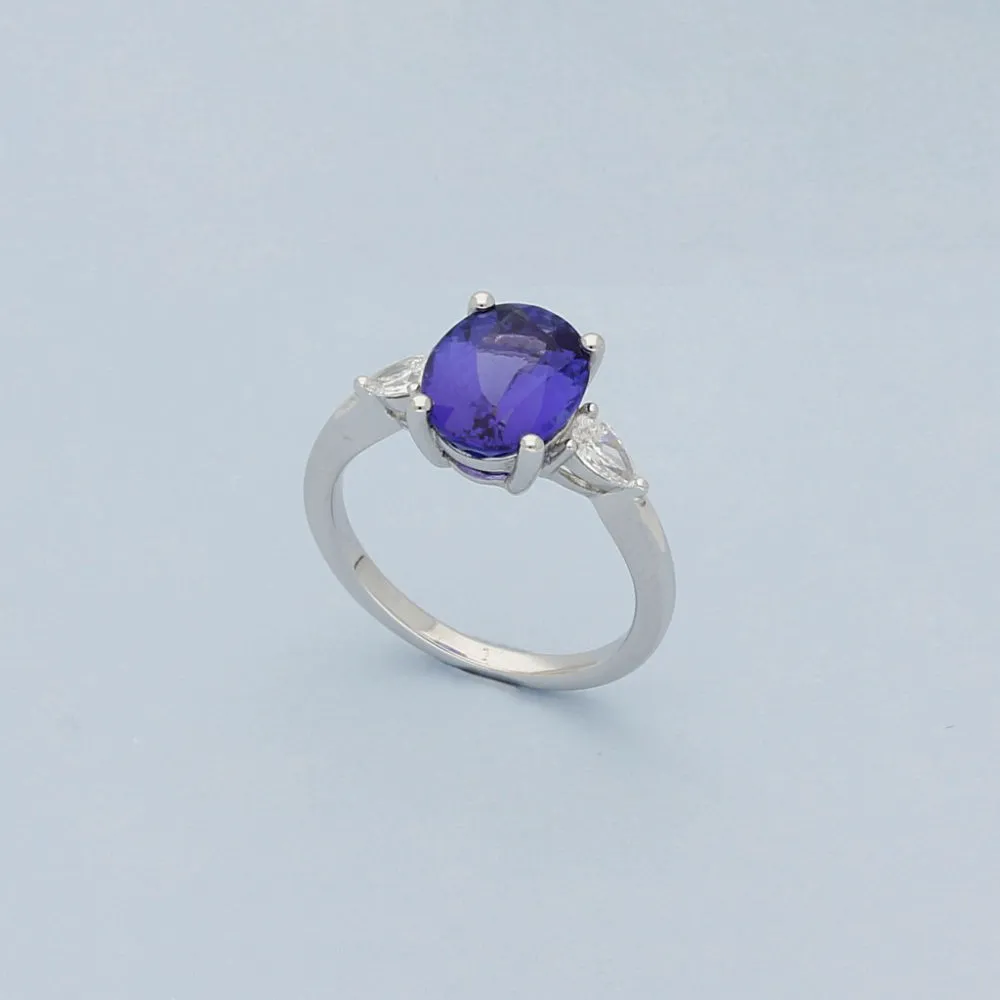 18ct White Gold Trilogy Ring with 3ct Tanzanite and Pear Shape Diamond Shoulders