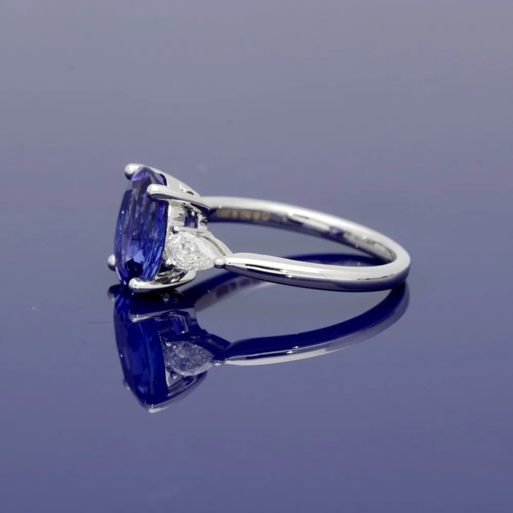 18ct White Gold Trilogy Ring with 3ct Tanzanite and Pear Shape Diamond Shoulders