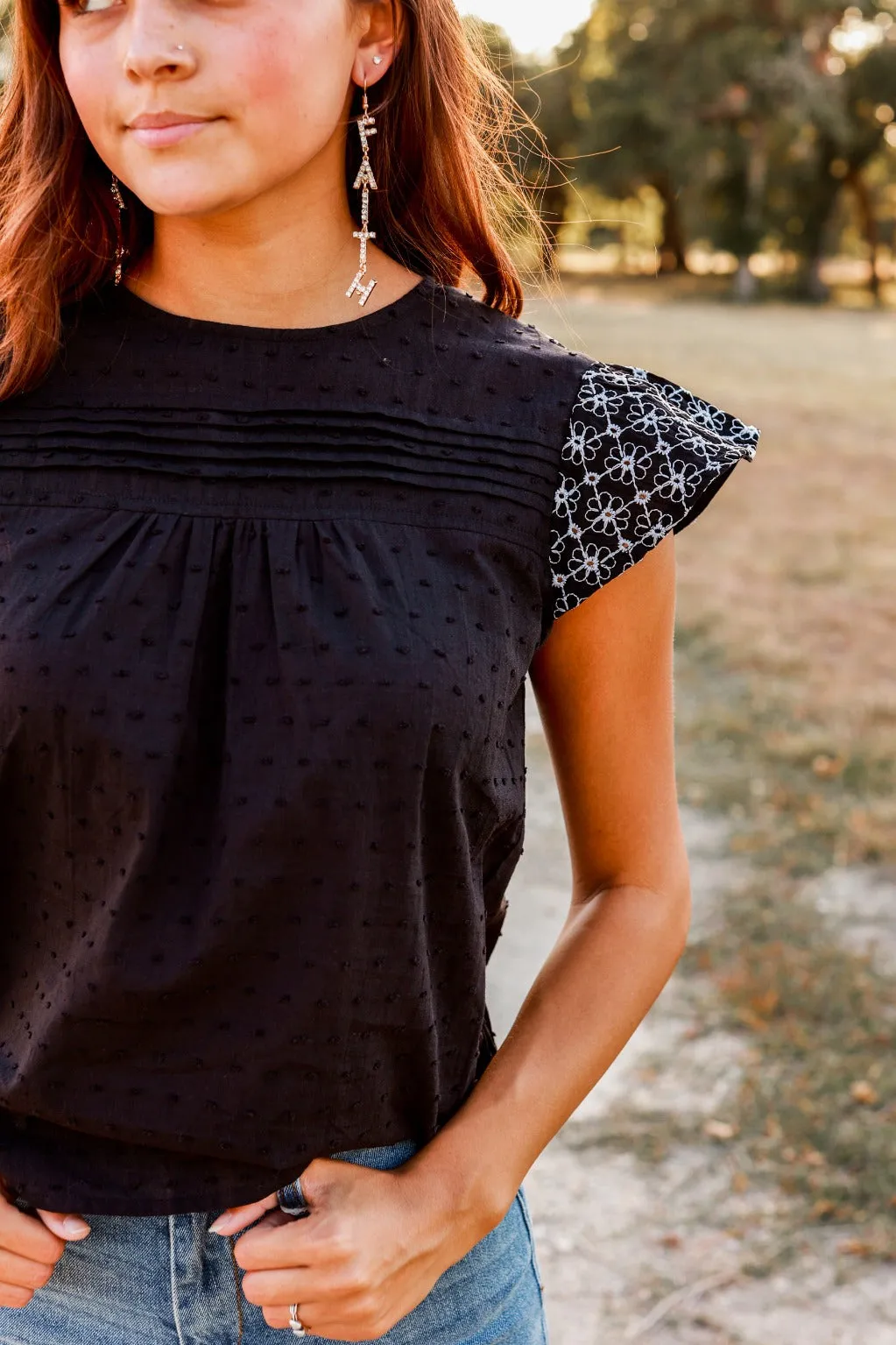 Black Top with Floral Eyelet Flutter Sleeves