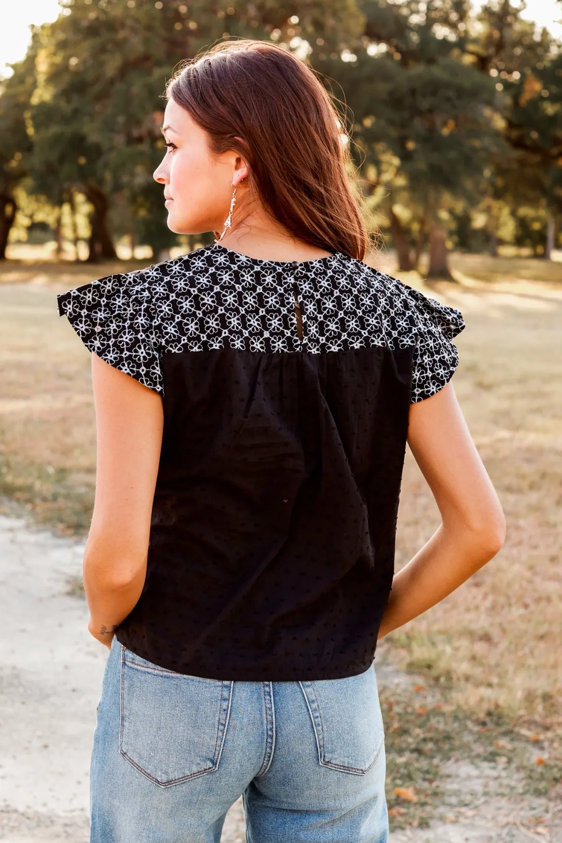 Black Top with Floral Eyelet Flutter Sleeves