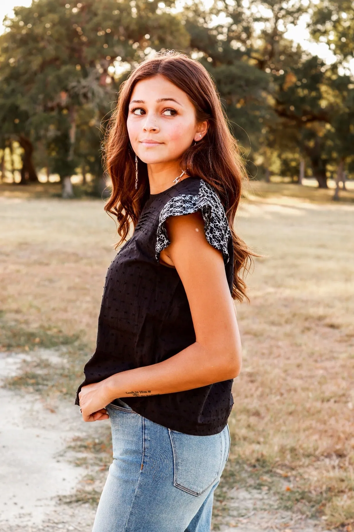 Black Top with Floral Eyelet Flutter Sleeves